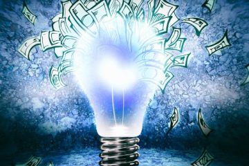 A lightbulb sourrounded by money